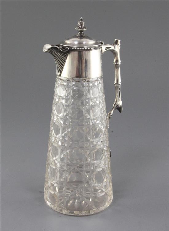 A late Victorian silver mounted cut glass claret jug by Goldsmiths & Silversmiths Co. Ltd, 10.25in.
